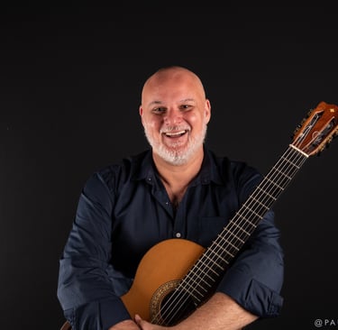 a man with a guitar and a guitar