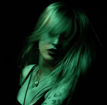 a woman with tattoos on her arm and a tattoo on her arm