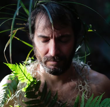 a man with a beard and a beard, wearing a hawaiian style lei lei lei