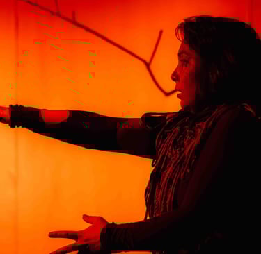 a man in a black shirt is pointing at something