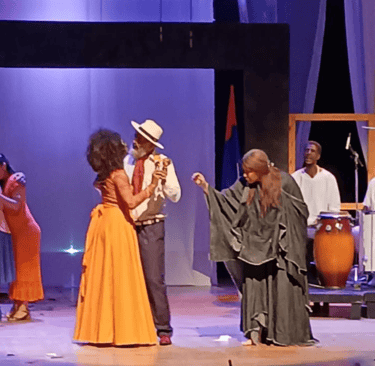 a man and woman in a stage setting