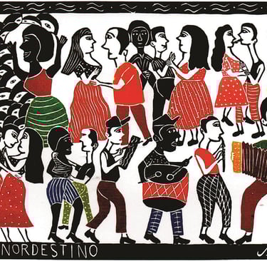 a group of people standing around a painting