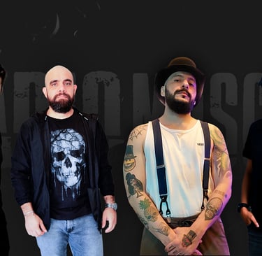 a group of men standing in front of a black background