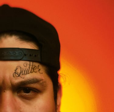 a man with a tattoo on his forehead