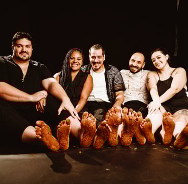 a group of people sitting on a bed