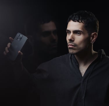 a man holding a cell phone in his hand