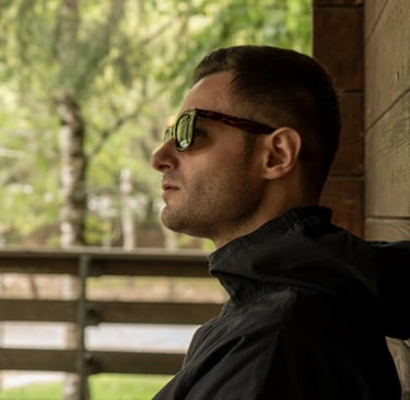 a man in sunglasses and sunglasses is looking at something