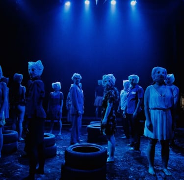 a group of mannequins in a stage setting