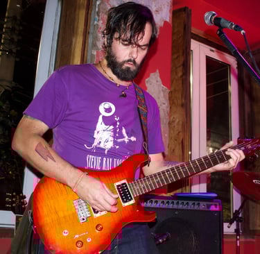 a man with a guitar and a guitar