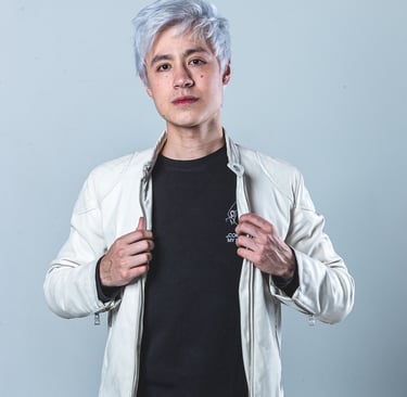a man with a white jacket and a black shirt