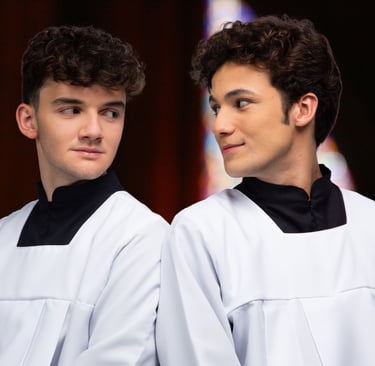 two men in white robes standing next to each other