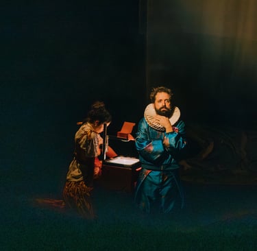 a man in a blue robe is holding a mirror