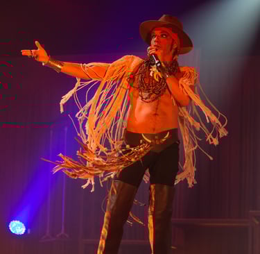 a man in a cowboy hat and a fringe fringe