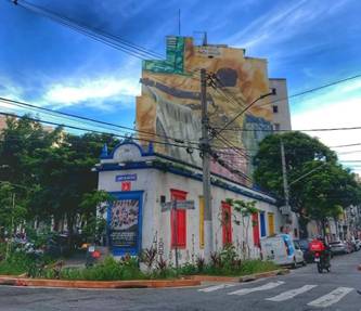 a building with a large mural of a man on the side of it