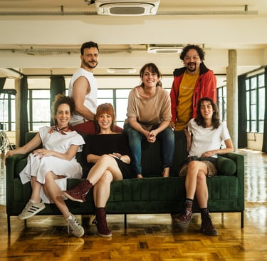 a group of people sitting on a couch in a room