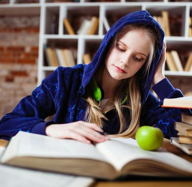 a high school student studying from a textbook