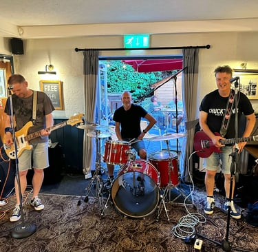 a band playing guitar in a country pub