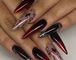 Manicura uñas color rojo oscuro vamp elegante tendencia invierno 2025 salón de belleza Calle Baleare