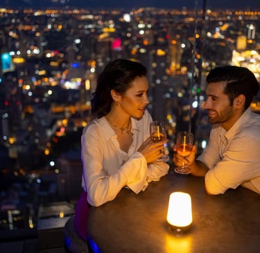 a sugar baby and sugar mommy sitting at a table with candles