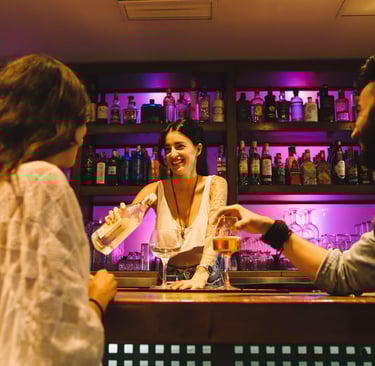 a sugar mommy is standing in front of a bar