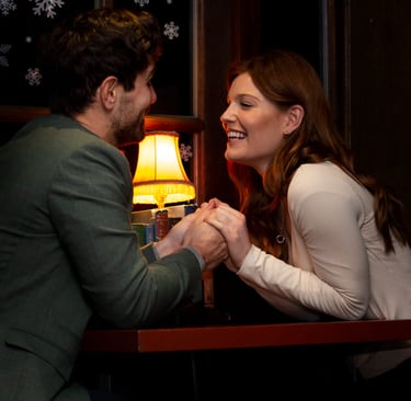 a sugar mommy and her sugar baby holding hands and smiling