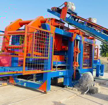 a machine that is being used to make a concrete block machine