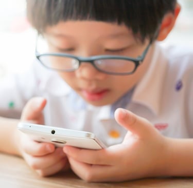 kid watching phone