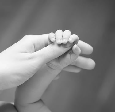 a baby's hand holding a baby's hand