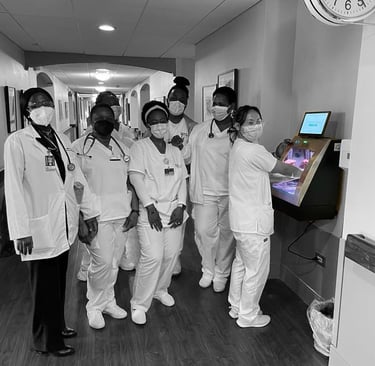 a group of nurses in white scrubies and masks