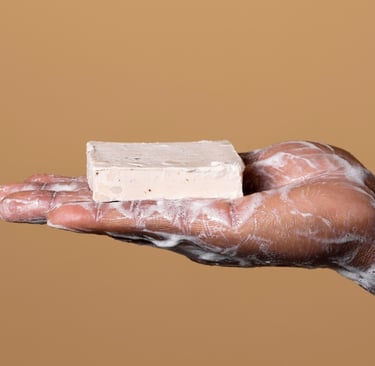 a person holding a soap bar in their hands