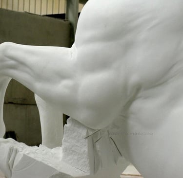 Elegant stone garden fountain featuring three rearing whitemarble horse statues in a circular basin.