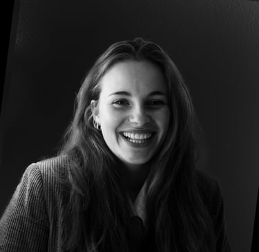 a woman with long hair and a smile on her face