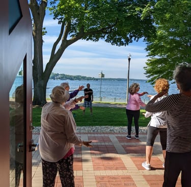 Johnny sharing Tai Chi outdoors at the Lake Geneva Public Library