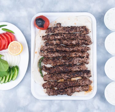 a plate of meat and vegetables on a table
