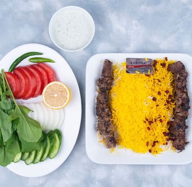 a plate of food with a fork and a knife on a table