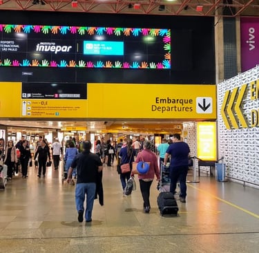 a group of people walking through a busy airport