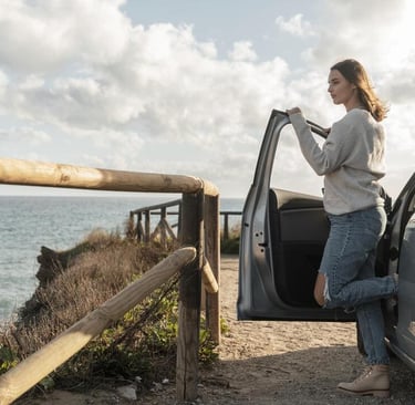 a woman standing next to a car door