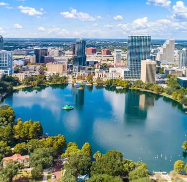 a city skyline view of a lake and a city