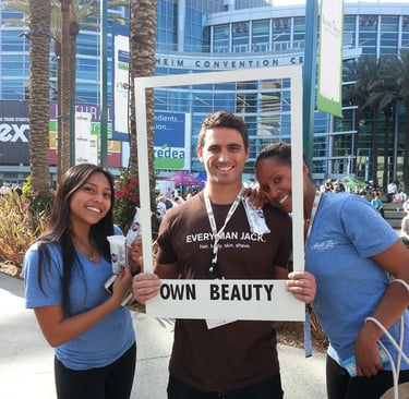 smiling brand ambassadors pose for photo with guests