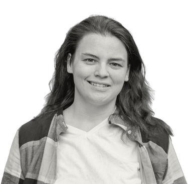 a woman with long hair and a plaid shirt