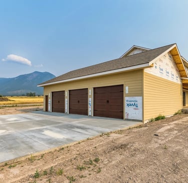Three car garage of a custom luxury home in western Montana by Saddle Horn