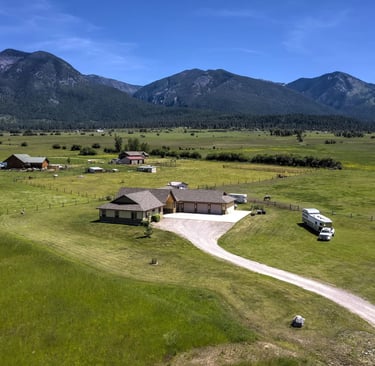 Aerial view of a Luxury montana home built next to the Mission mountains