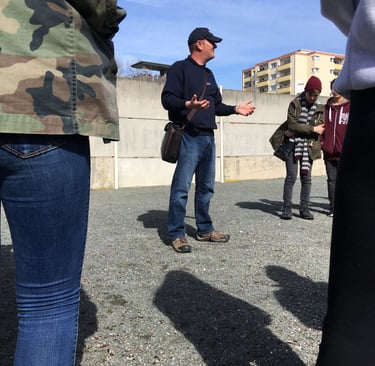 Andrew White at the Berlin Wall memorial talking about the Cold War and the division of Berlin