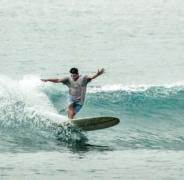 Ucup batukaras longboard surf lessons