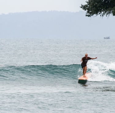 a man is surfing on a wave in the ocean
