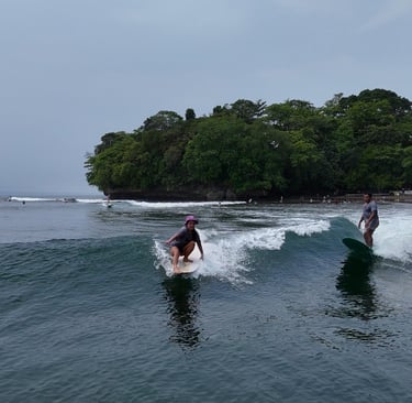 Surf lessons longboarding in Batukaras with Ucup of USurf Batukaras