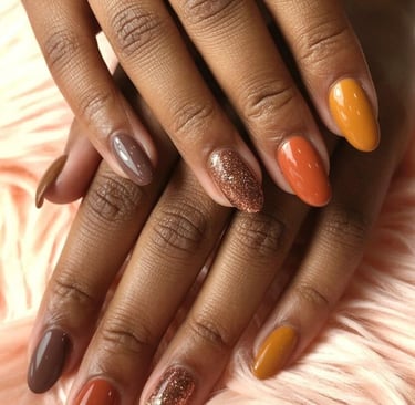 Glossy multicolor fall nails featuring chocolate brown, burnt orange, mustard yellow, and bronze gli
