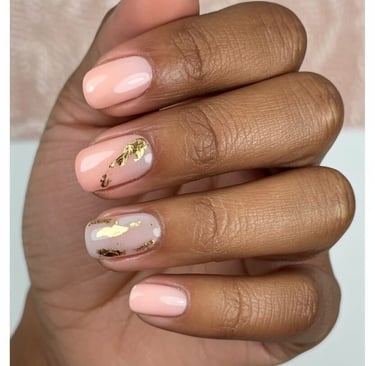 Elegant blush pink and nude nails decorated with gold foil flakes – classy fall nail design idea wit