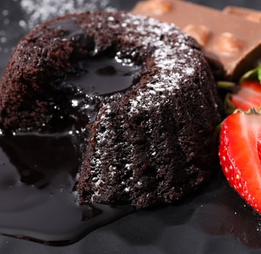 a chocolate cake with chocolate and strawberries on a plate