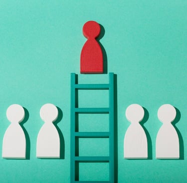 a red person icon on top of a ladder with white people icons either side of the bottom of the ladder